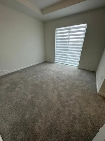 a view of a room that has a window in it