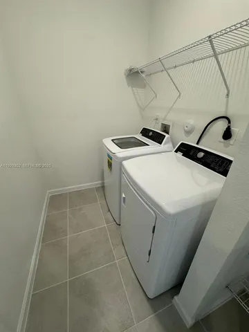 a view of balcony with wooden floor and fence