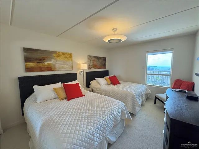 a bedroom with bed and a night stand