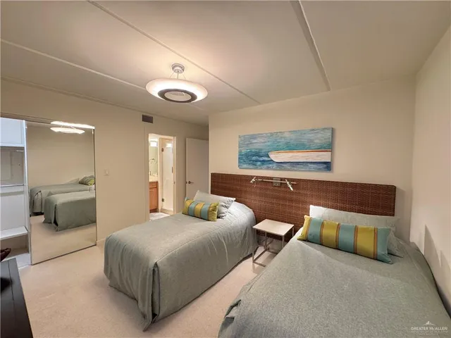 a bedroom with a bed and a couch