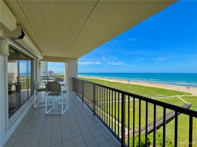 a view of a balcony with chairs