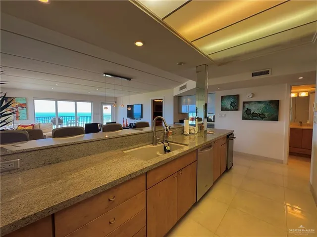 a lobby with furniture and a potted plant