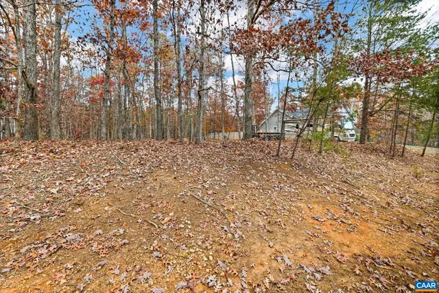 a view of a swimming pool with an outdoor space and seating area