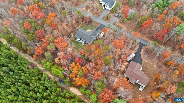 a view of city with lush green field