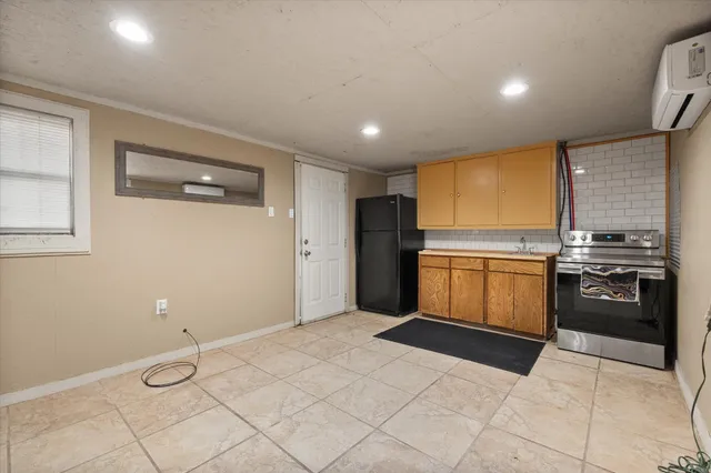 a kitchen with a refrigerator sink and stove