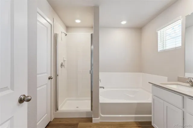 a bathroom with a shower and a tub