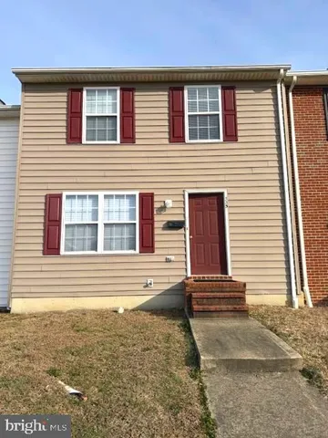a view of a house with wooden floor and fence