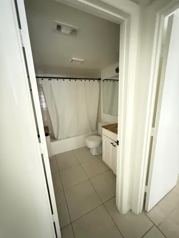 a bathroom with a sink and toilet
