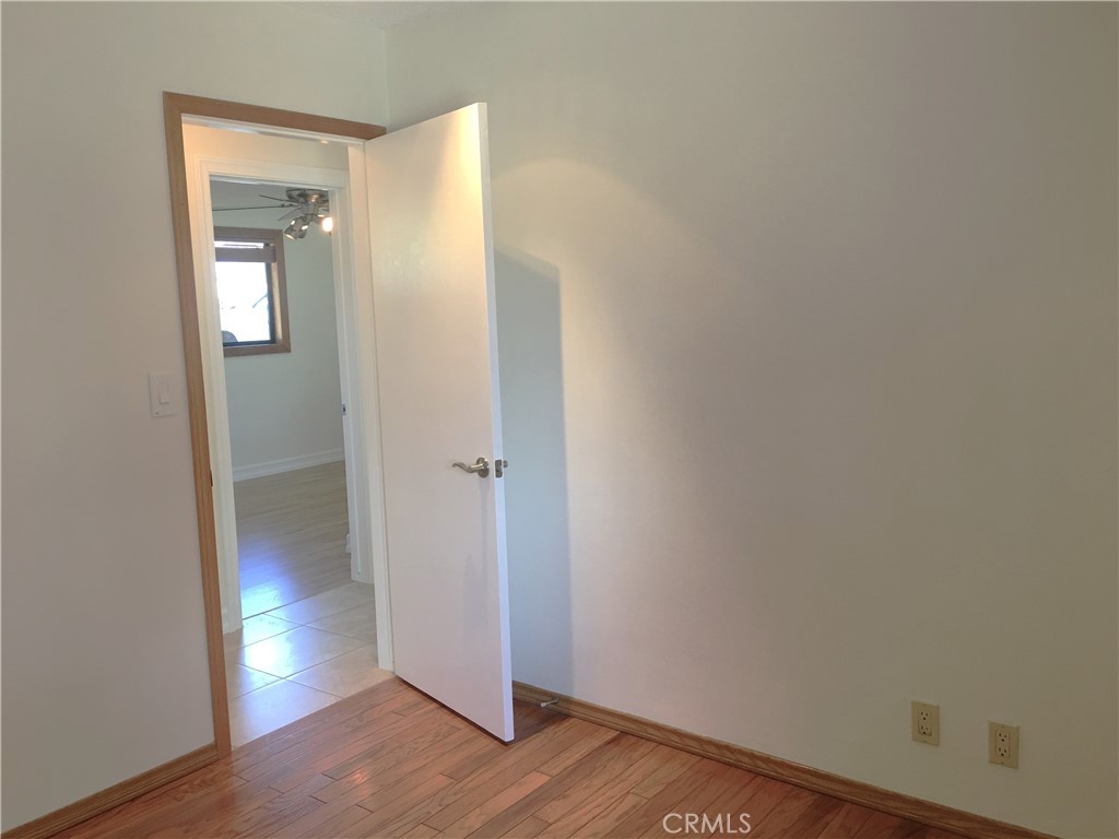 10011 Bernice Circle Buena Park, CA 90620 - Photo 14 of 28 a view of an empty room with wooden floor