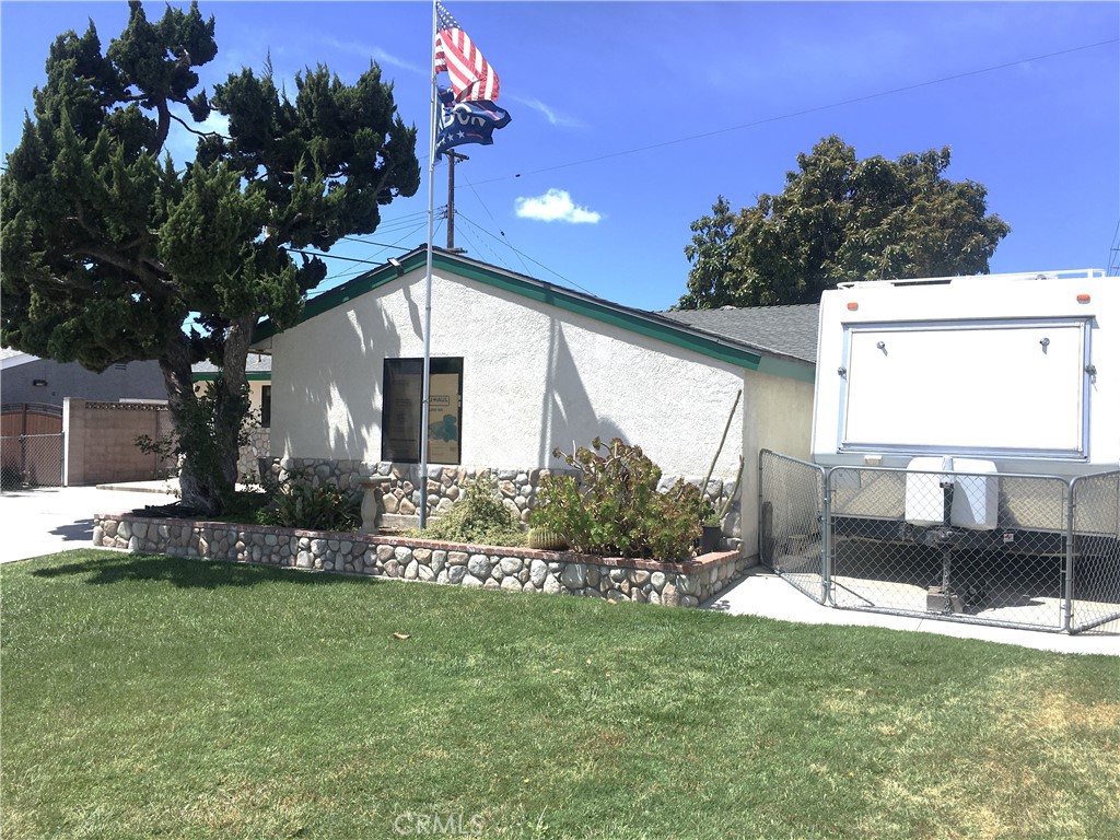 10011 Bernice Circle Buena Park, CA 90620 - Photo 27 of 28 a front view of a house with a yard