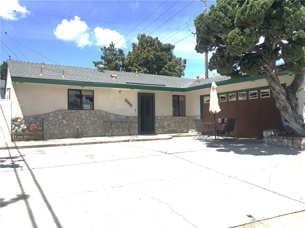 10011 Bernice Circle Buena Park, CA 90620 - Photo 28 of 28 a front view of a house with a yard