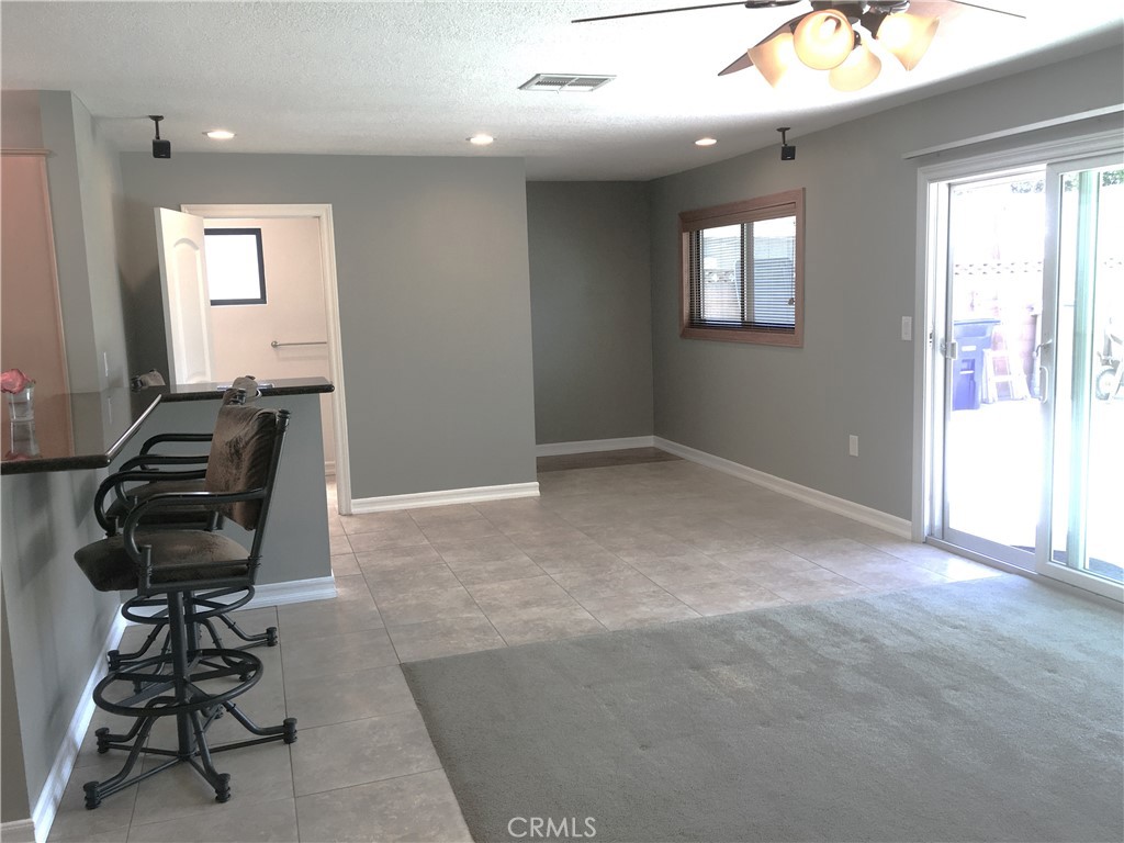 10011 Bernice Circle Buena Park, CA 90620 - Photo 7 of 28 a view of a livingroom with workspace and windows