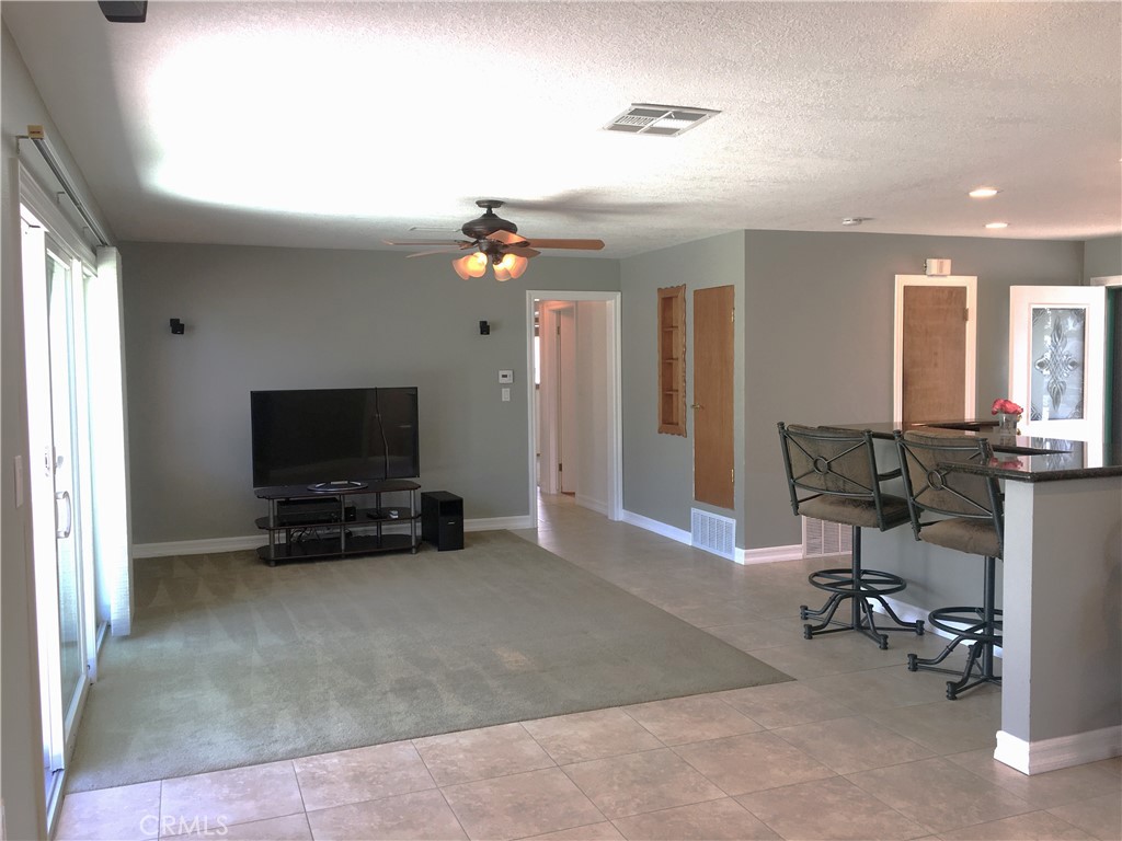 10011 Bernice Circle Buena Park, CA 90620 - Photo 8 of 28 a view of a livingroom with furniture and a flat screen tv
