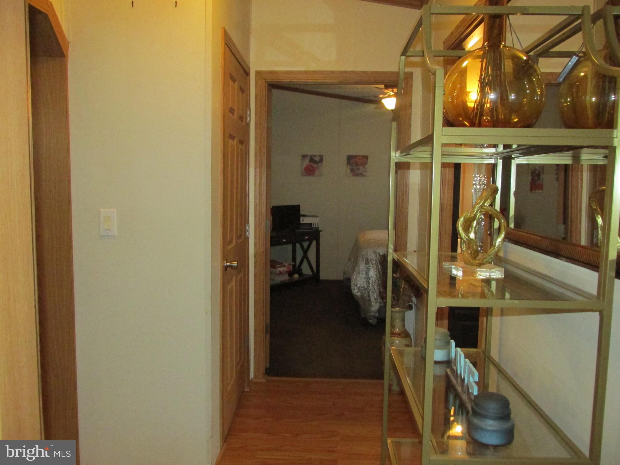 6539 Cabin Ridge Road Hurlock, MD 21643 - Photo 15 of 31 a view of walk in closet with clothes and shoes