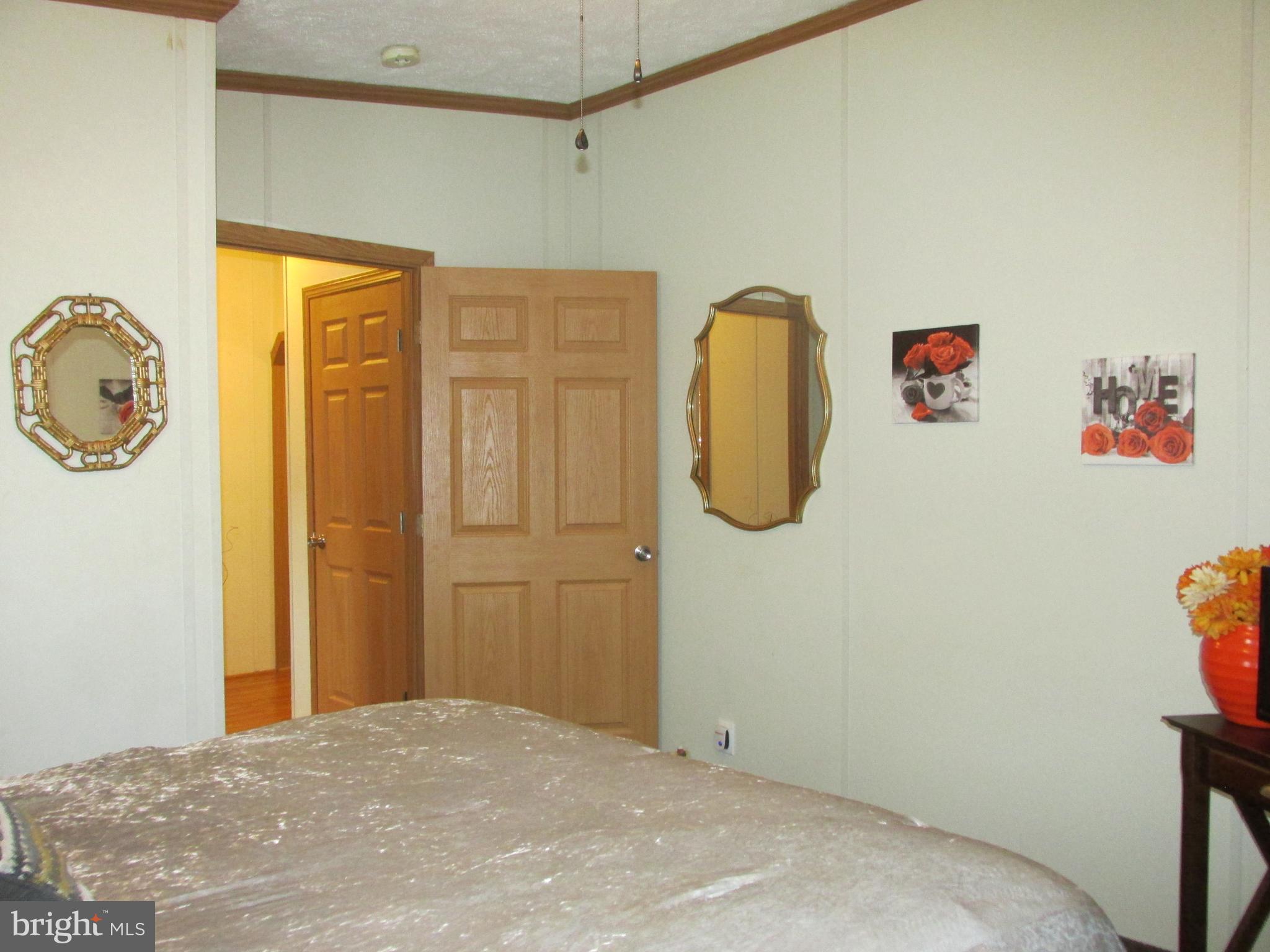 6539 Cabin Ridge Road Hurlock, MD 21643 - Photo 20 of 31 a bedroom with a bed and a window