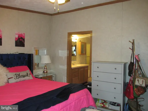 a bedroom with a bed and a closet