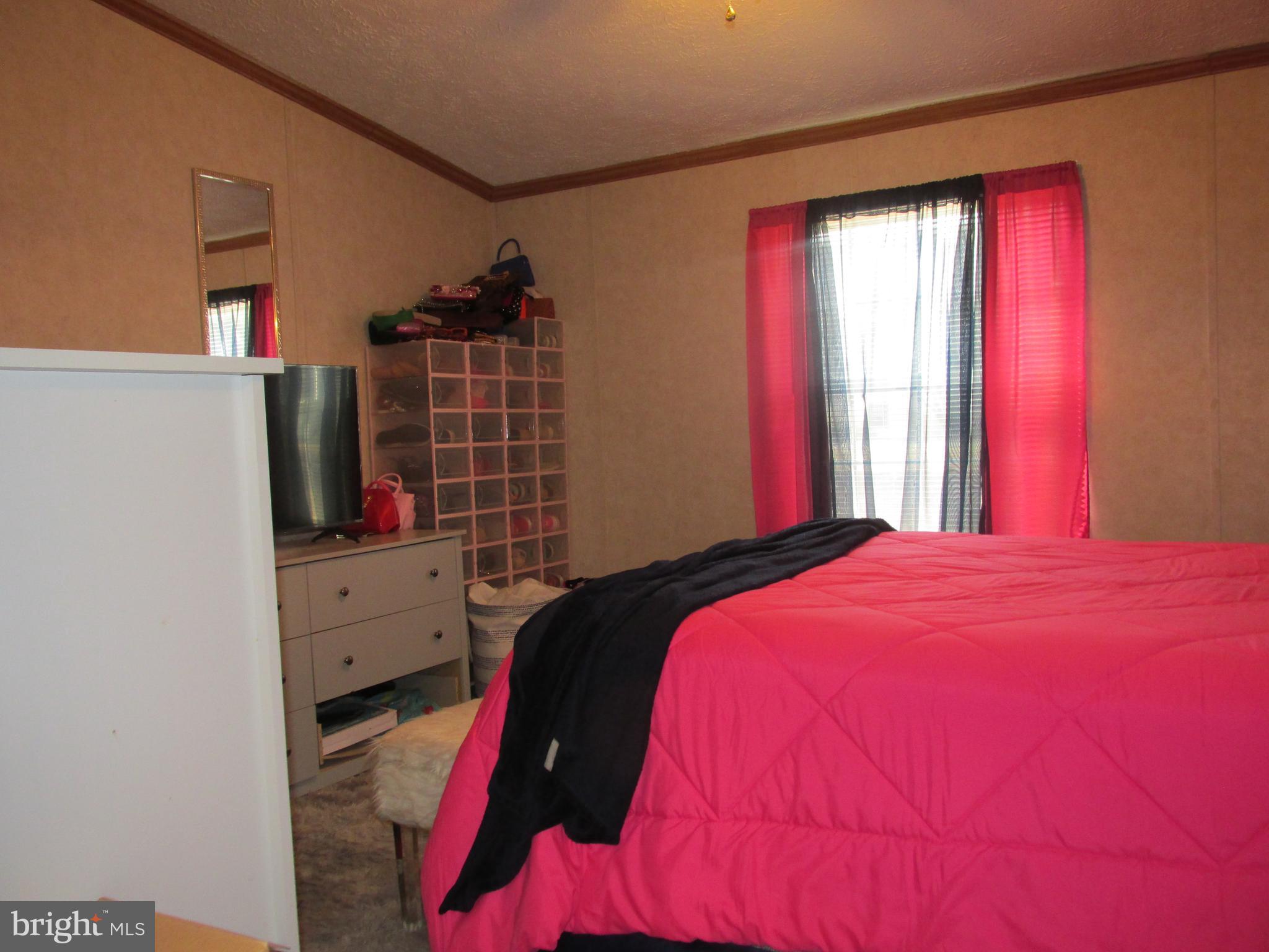 6539 Cabin Ridge Road Hurlock, MD 21643 - Photo 24 of 31 a bed room with a bed and a window