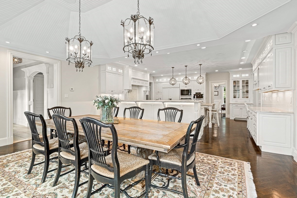 11 Village Lane Needham, MA 02492 - Photo 11 of 42 a view of a dining room with furniture a chandelier and wooden floor