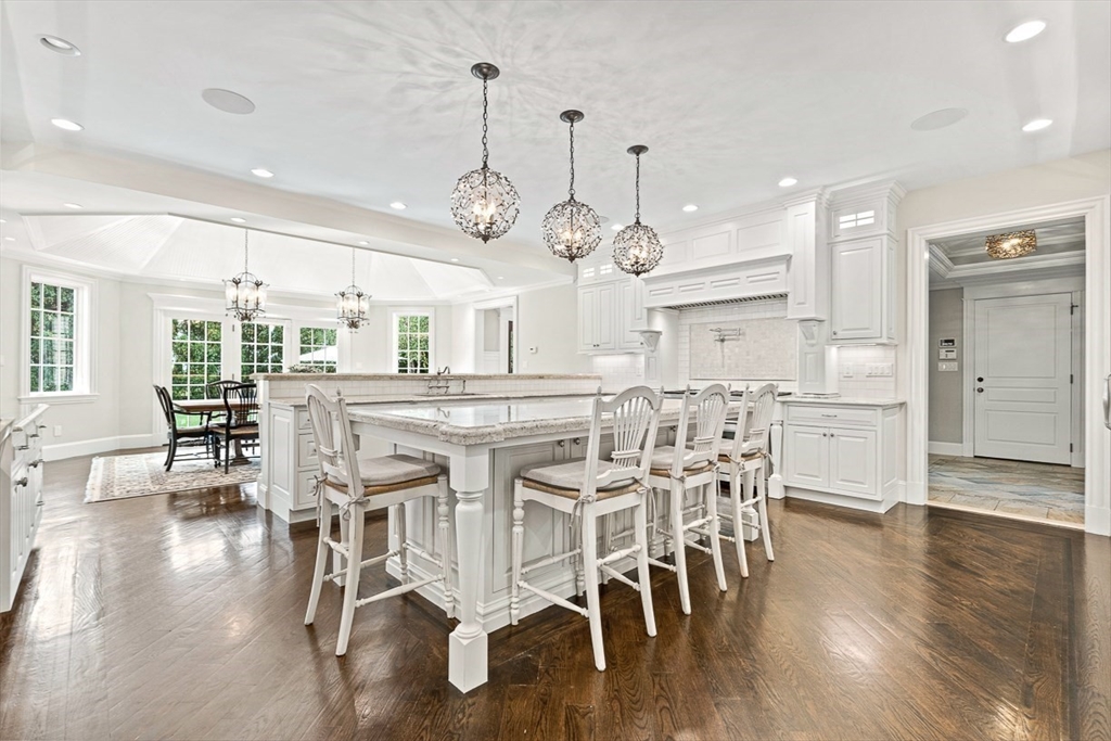 11 Village Lane Needham, MA 02492 - Photo 13 of 42 a large kitchen with a table and chairs