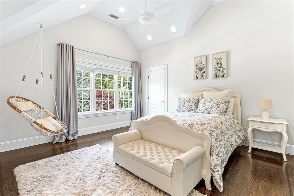 11 Village Lane Needham, MA 02492 - Photo 21 of 42 a spacious bedroom with a bed and a couch