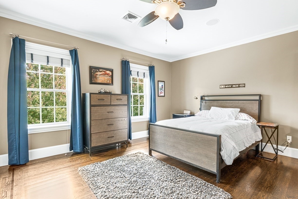 11 Village Lane Needham, MA 02492 - Photo 22 of 42 a bedroom with a bed and a dresser