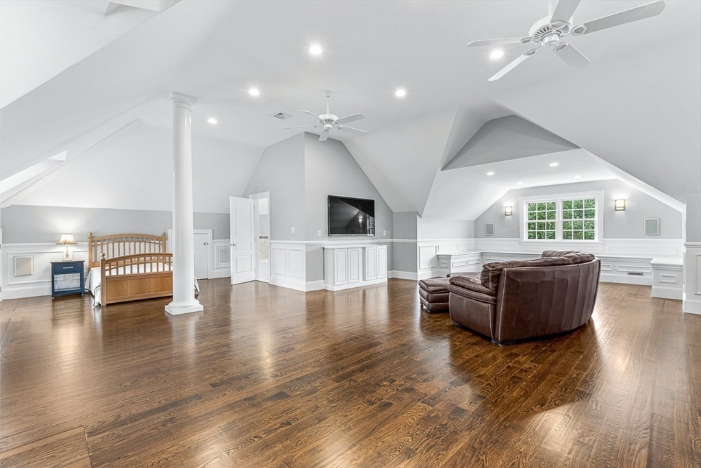 11 Village Lane Needham, MA 02492 - Photo 23 of 42 a living room with couches and kitchen view with wooden floor