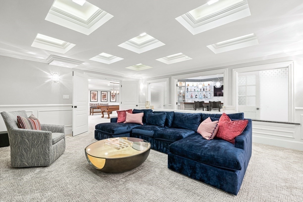 11 Village Lane Needham, MA 02492 - Photo 26 of 42 a living room with furniture and a potted plant