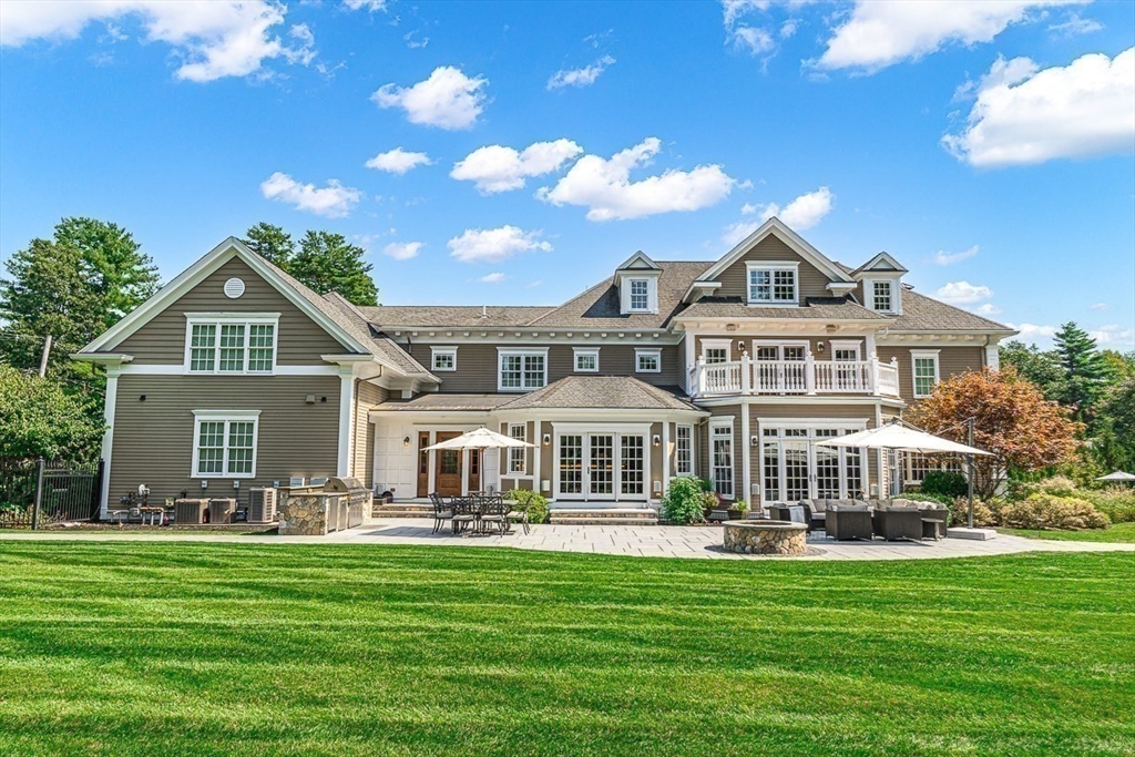 11 Village Lane Needham, MA 02492 - Photo 34 of 42 a front view of a house with a garden