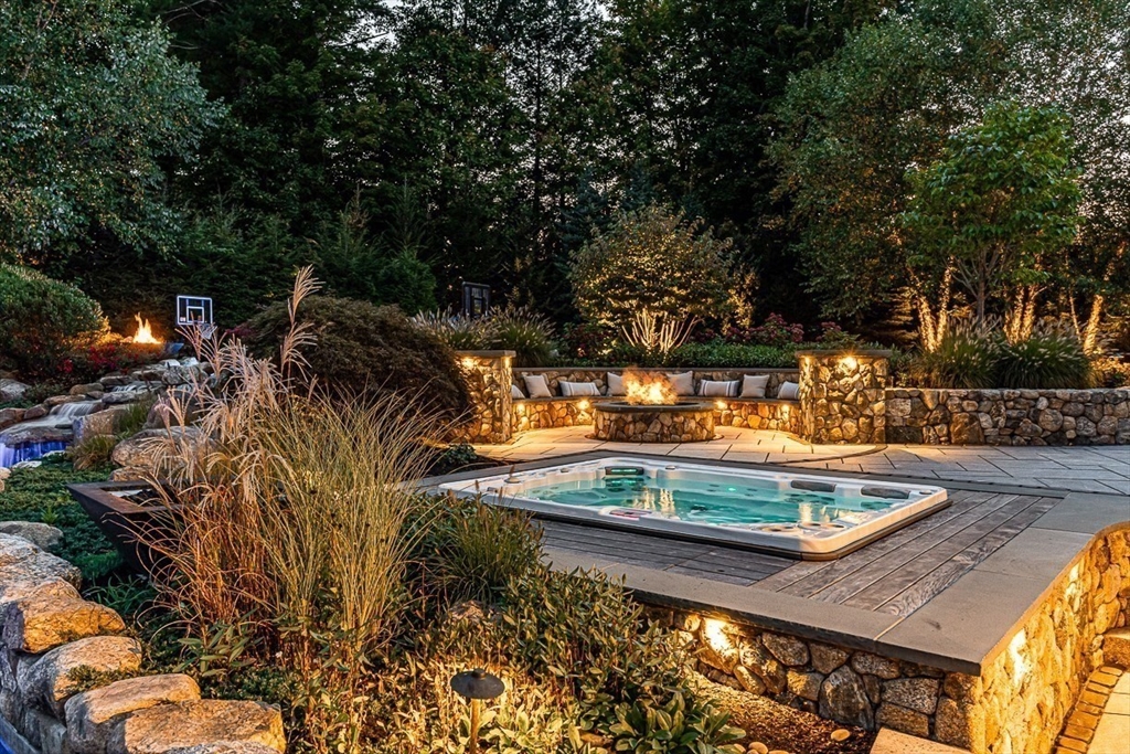 11 Village Lane Needham, MA 02492 - Photo 36 of 42 a view of a backyard with plants and a patio