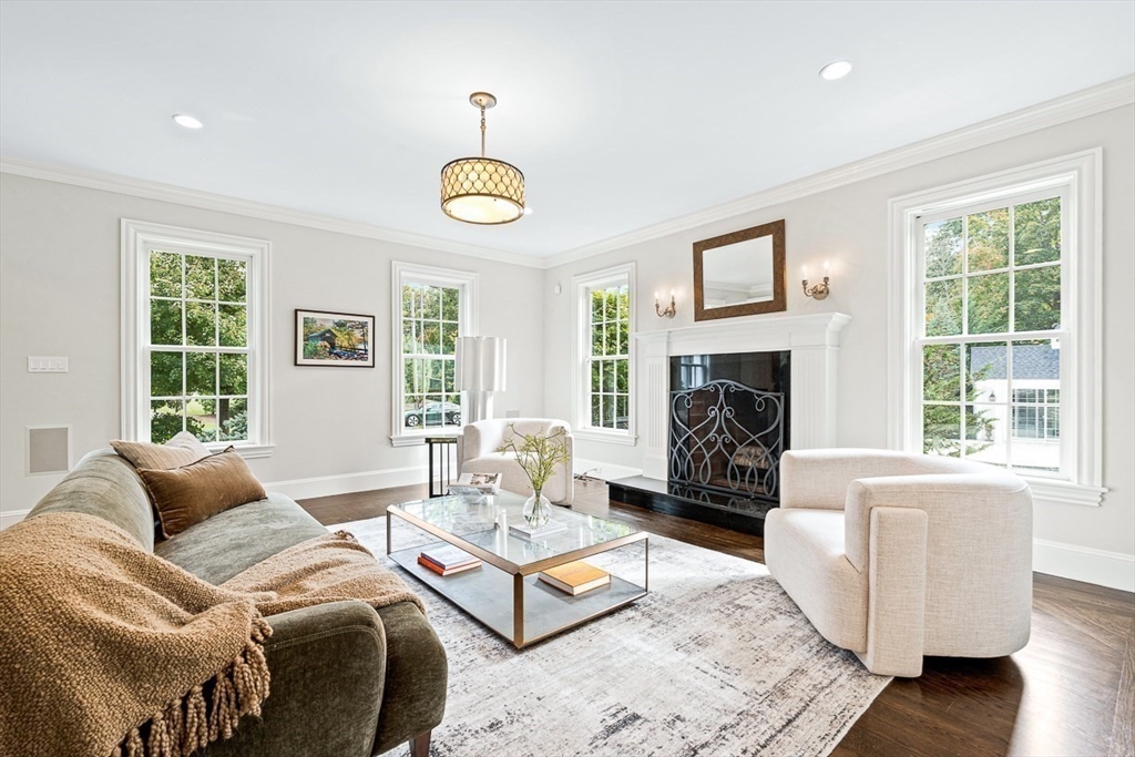 11 Village Lane Needham, MA 02492 - Photo 6 of 42 a living room with furniture fireplace and window