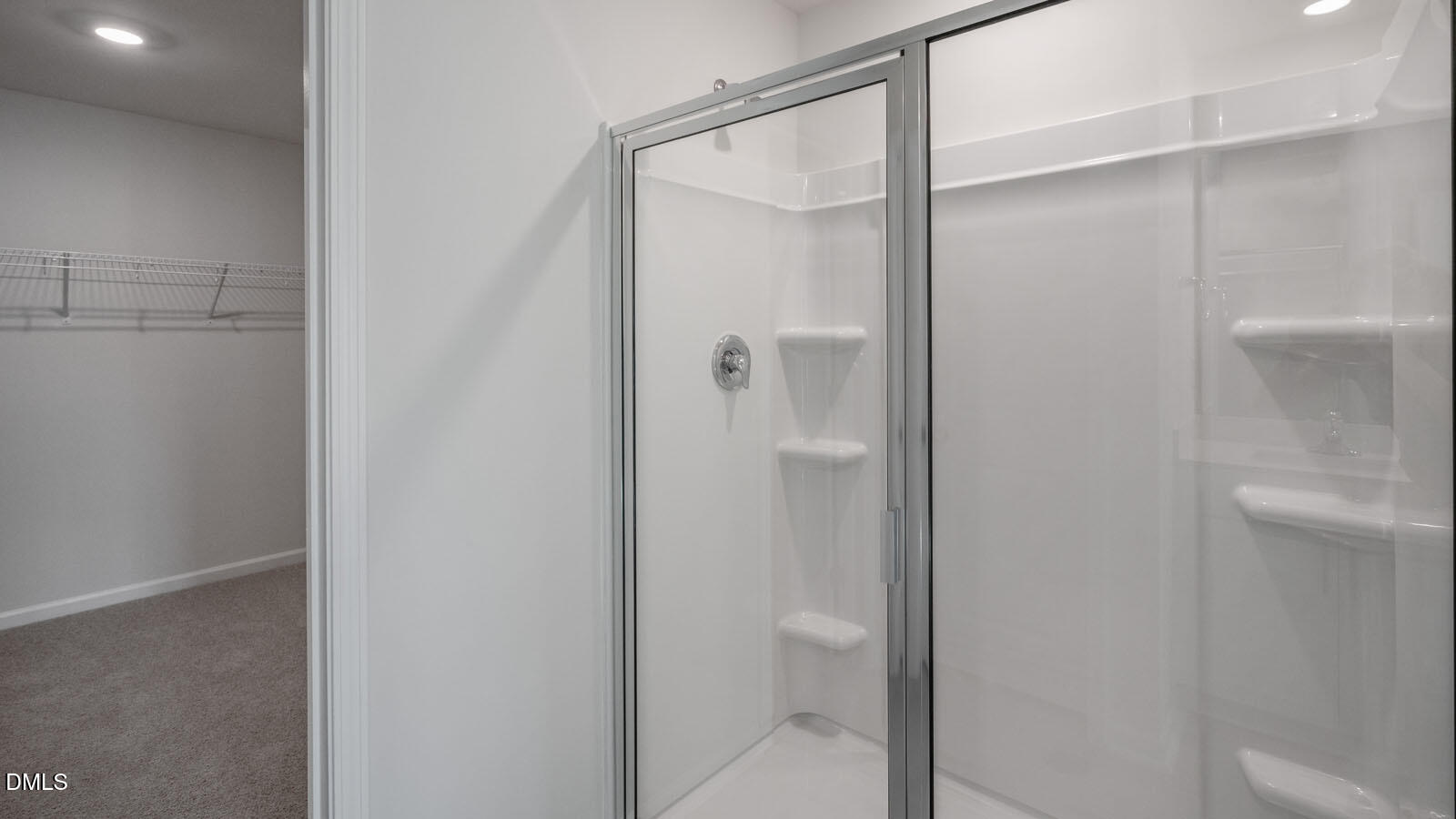 1261 Pavo Path Wendell, NC 27591 - Photo 18 of 40 a bathroom with a glass shower door