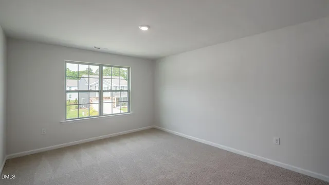 swimming pool view with a seating space