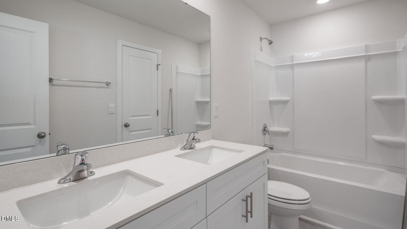1261 Pavo Path Wendell, NC 27591 - Photo 24 of 40 a bathroom with a sink toilet vanity and shower
