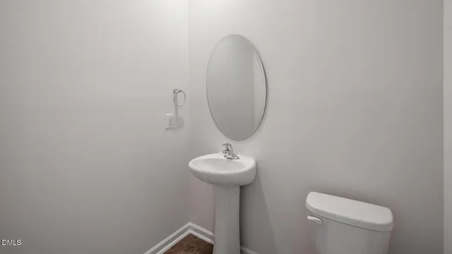 a kitchen that has a sink a stove and a table in it