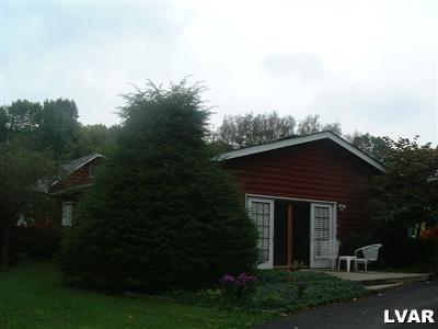 786 Andrews Road Bath, PA 18014 - Photo 3 of 8 a view of a yard in front of a house with a large tree