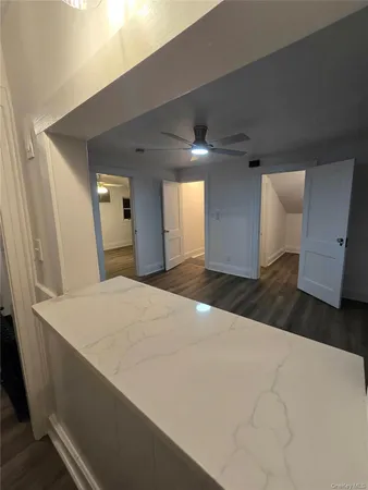 a large white bed in a white room