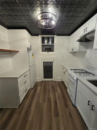 a kitchen with a stove and a microwave