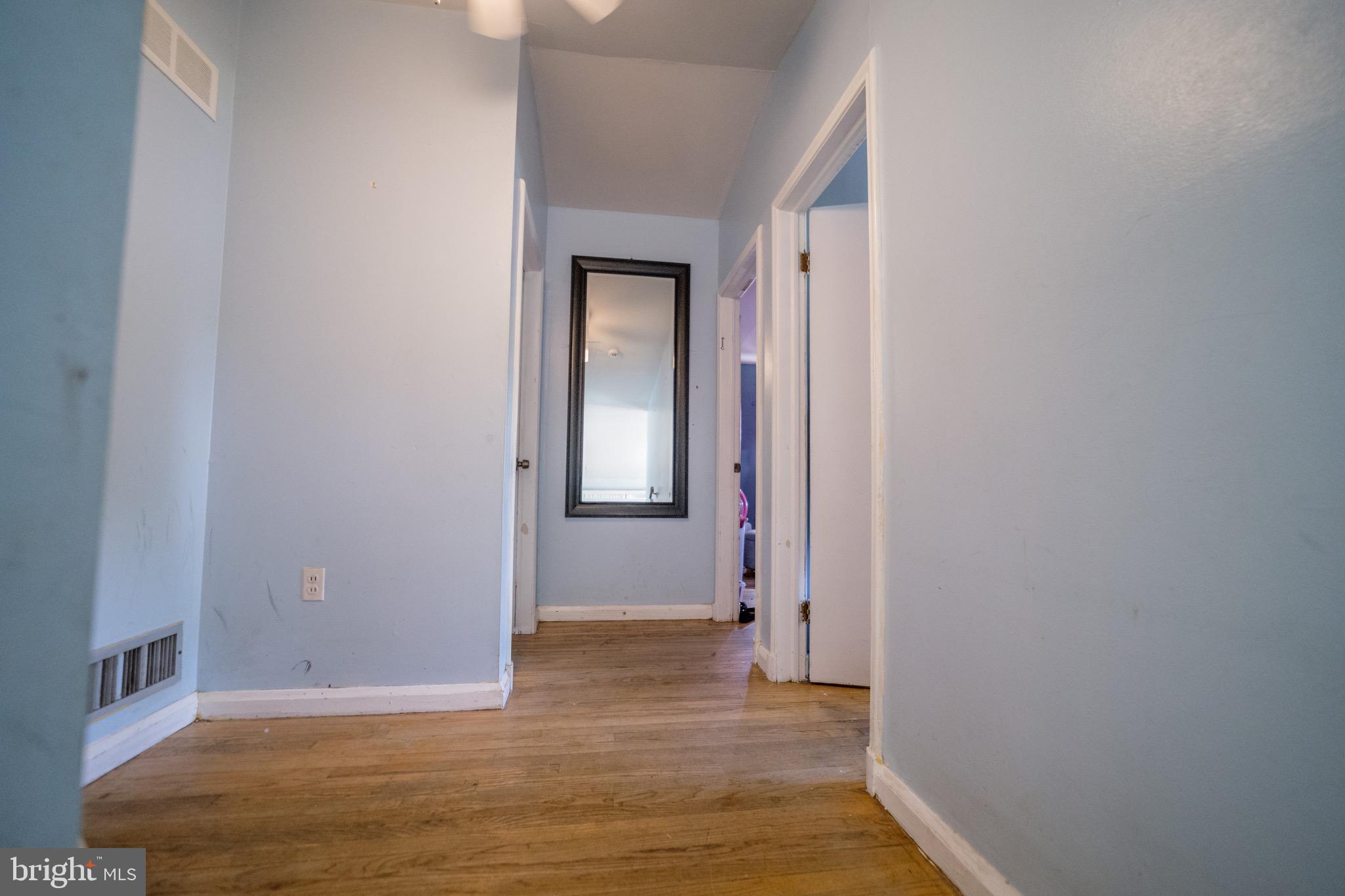 4125 Ronis Road Pikesville, MD 21208 - Photo 5 of 40 a view of a hallway with wooden floor