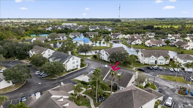 an aerial view of a house with a lake view