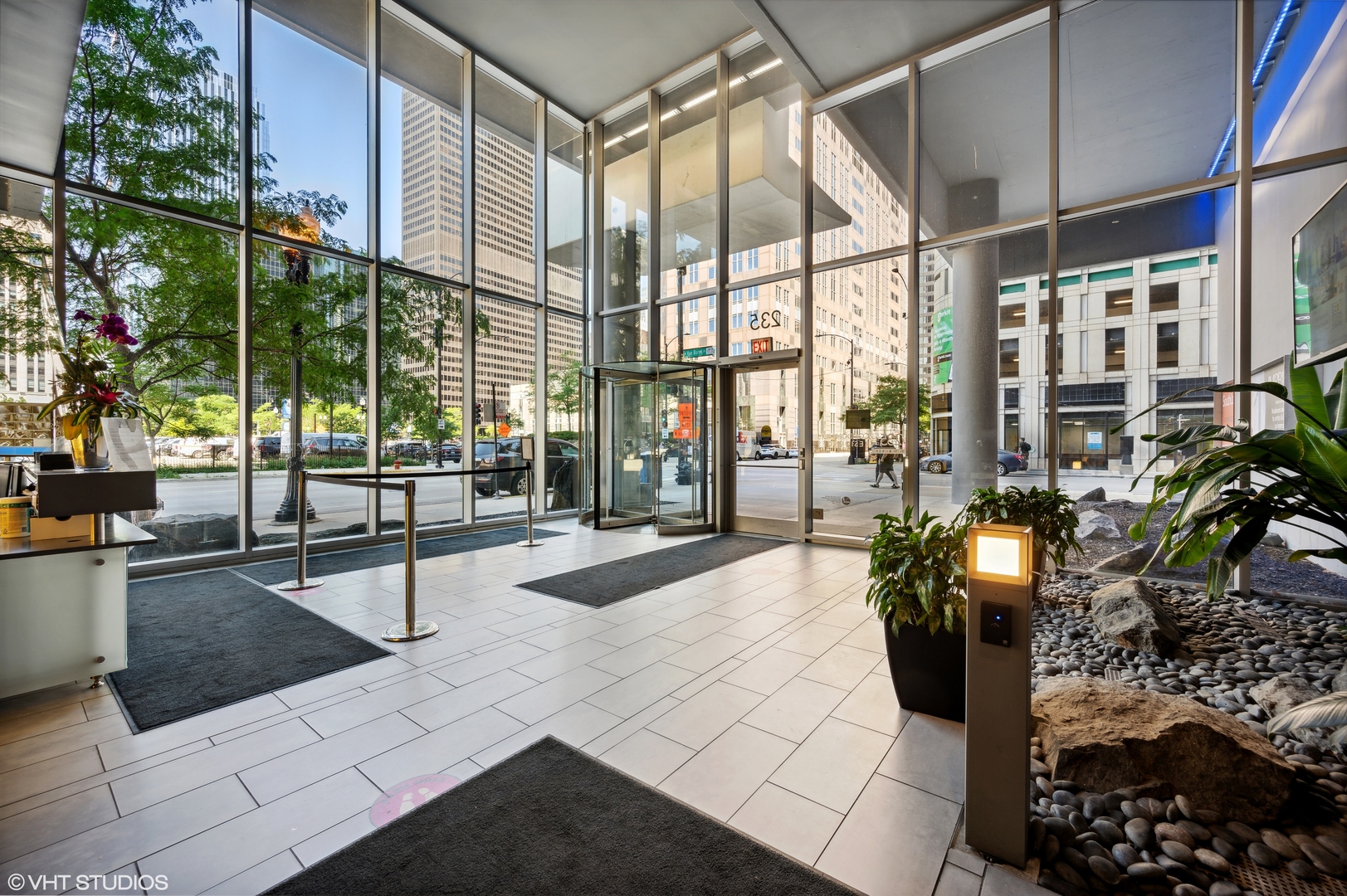 235 West Van Buren Street, Unit 1506 Chicago, IL 60607 - Photo 15 of 16 a lobby with furniture and floor to ceiling window