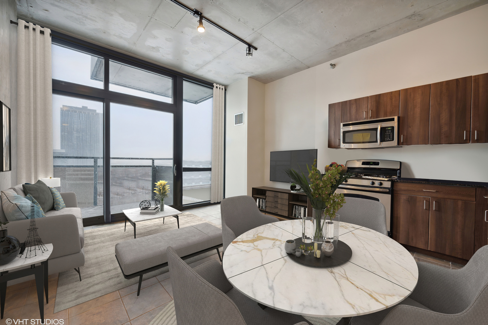 235 West Van Buren Street, Unit 1506 Chicago, IL 60607 - Photo 2 of 16 a kitchen with a table and chairs in it