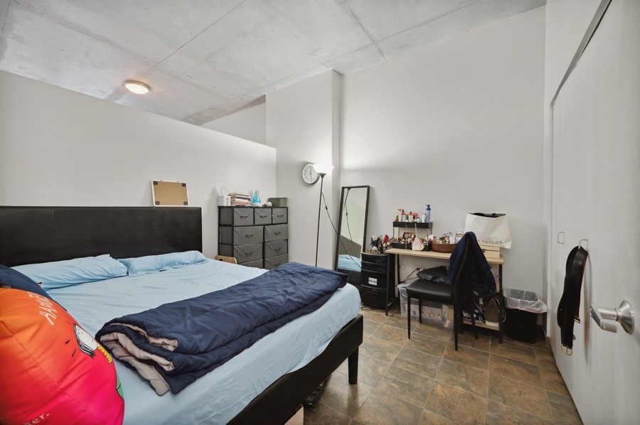 235 West Van Buren Street, Unit 1506 Chicago, IL 60607 - Photo 6 of 16 a living room with furniture and a wooden floor