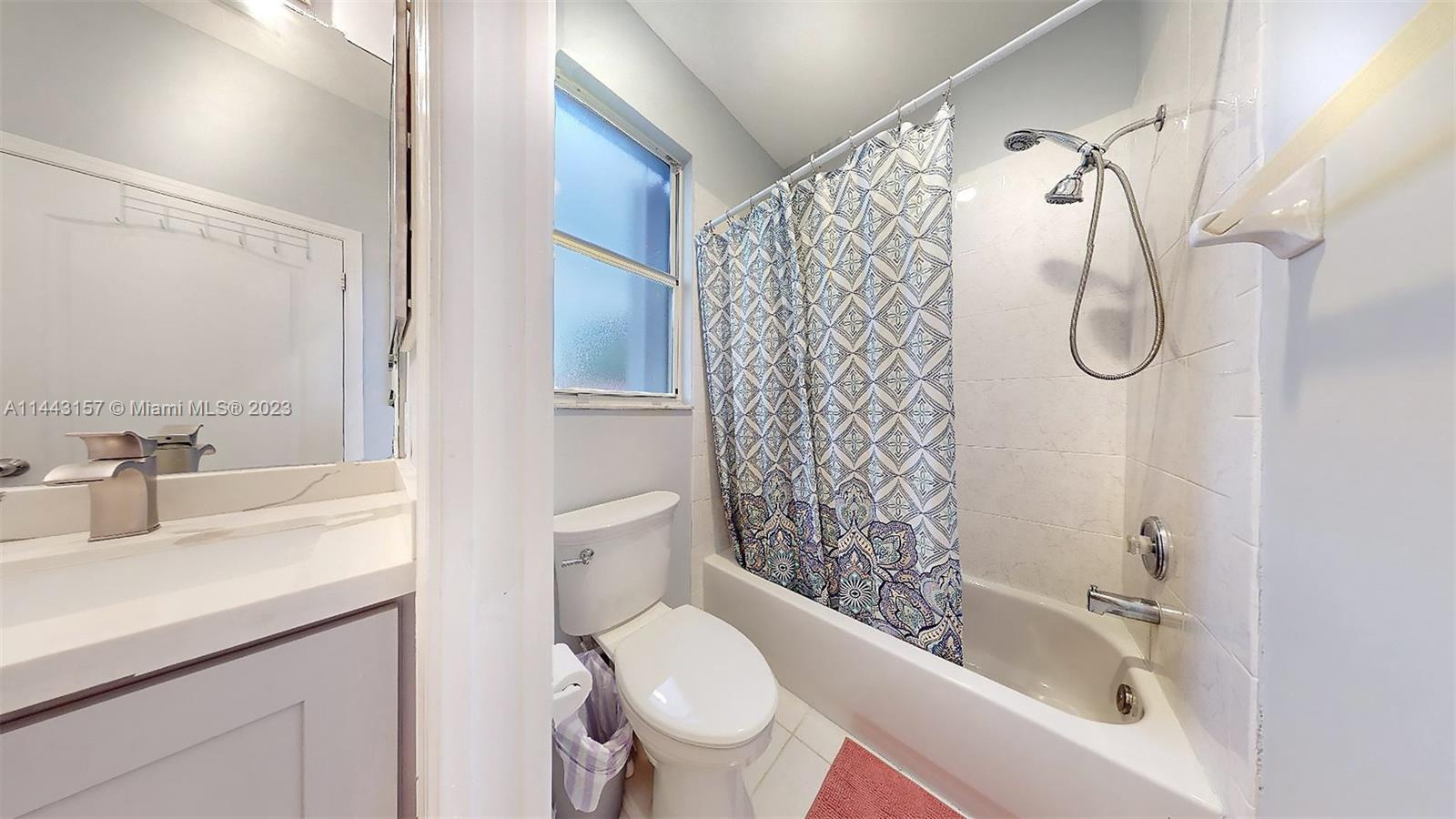 2231 Northeast 37th Road Homestead, FL 33033 - Photo 26 of 49 a bathroom with a sink a toilet and shower