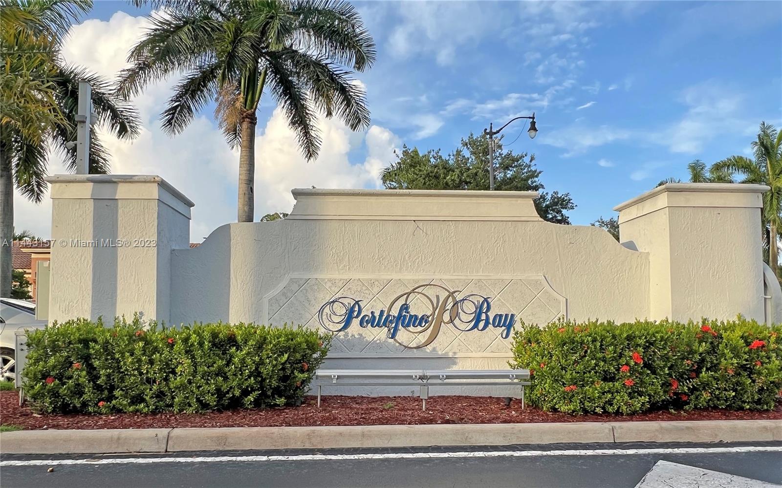 2231 Northeast 37th Road Homestead, FL 33033 - Photo 37 of 49 a front view of multi story residential apartment building with yard and sign board