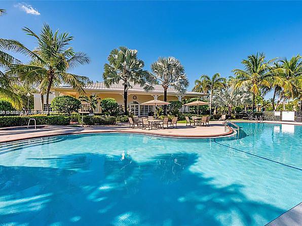 2231 Northeast 37th Road Homestead, FL 33033 - Photo 40 of 49 a view of a swimming pool with a table and chairs