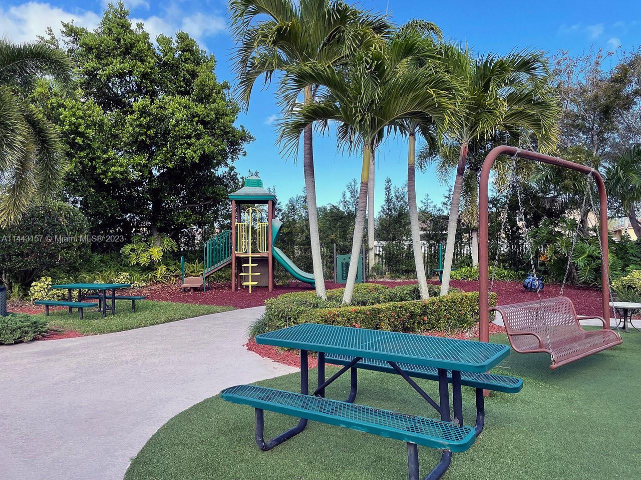 2231 Northeast 37th Road Homestead, FL 33033 - Photo 47 of 49 a view of a park with sitting area and slide