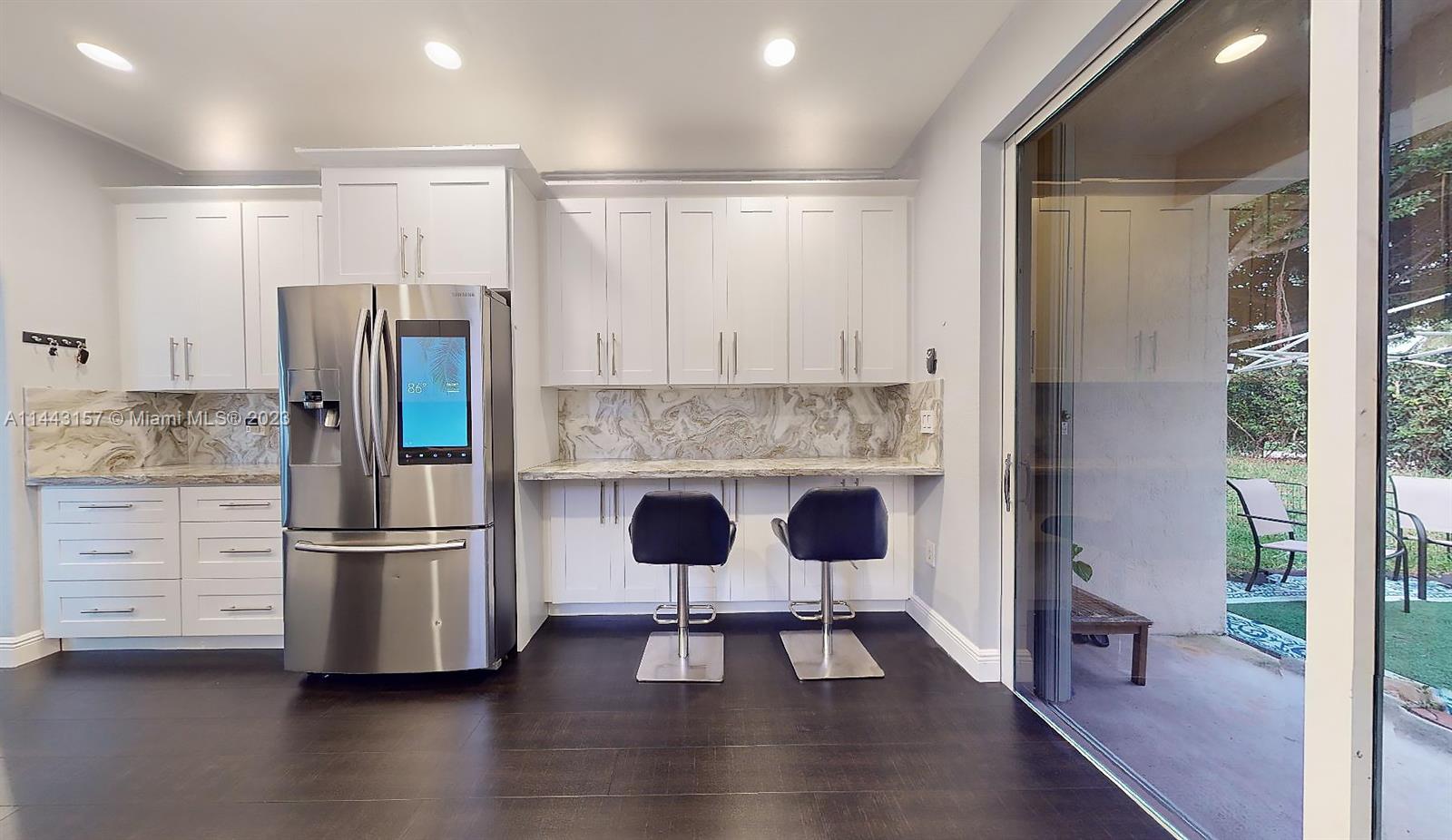 2231 Northeast 37th Road Homestead, FL 33033 - Photo 8 of 49 a kitchen with stainless steel appliances granite countertop a refrigerator and a stove