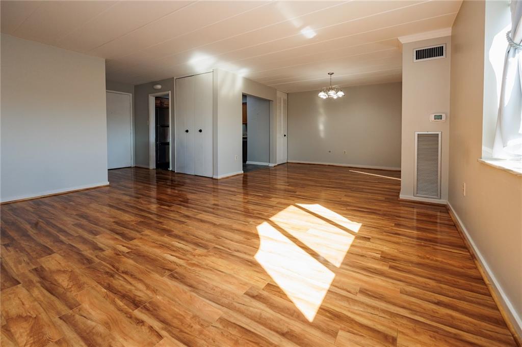 5 Bayard Road, Unit 717 Pittsburgh, PA 15213 - Photo 15 of 46 a view of empty room with wooden floor and fan