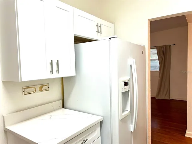 a bathroom with a shower and a sink