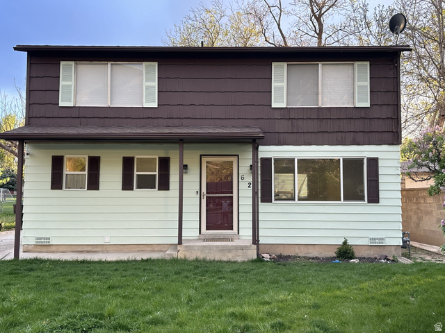 Two-story residence featuring a covered front entry
